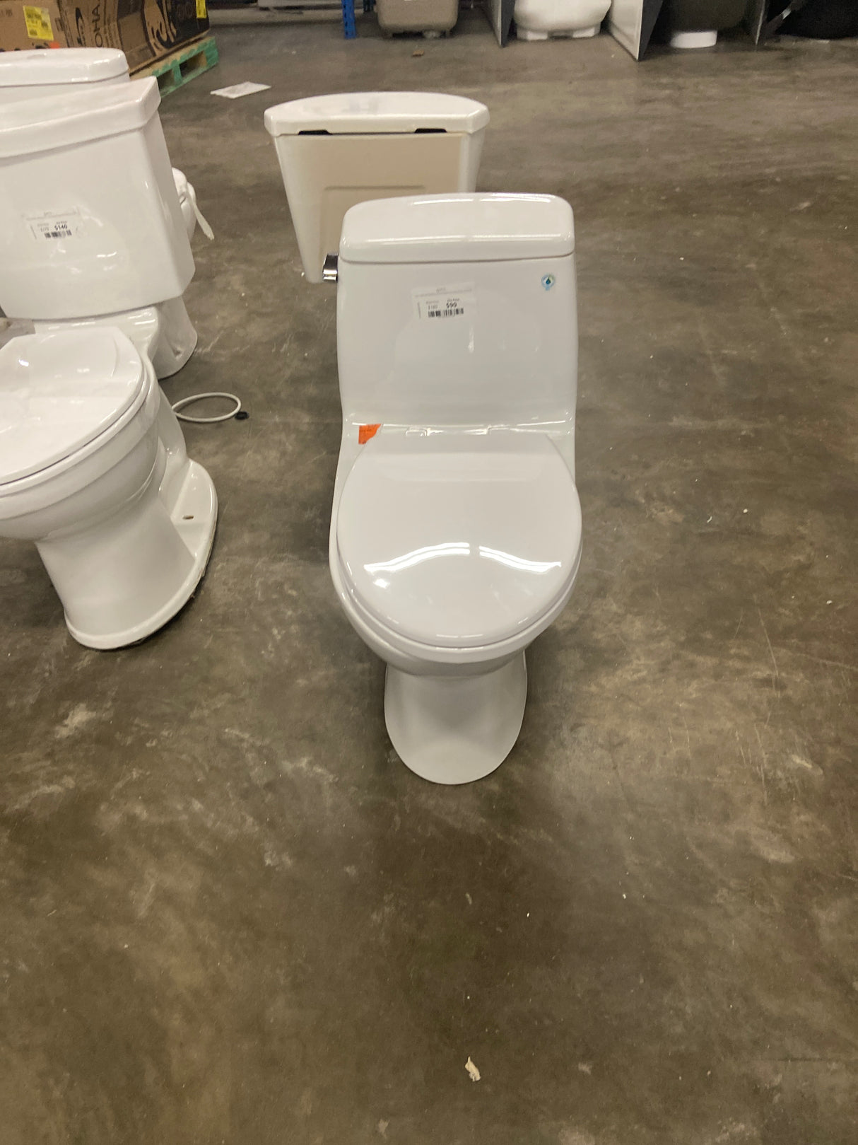 1-piece 1.1 GPF/1.6 GPF High Efficiency Dual Flush Elongated Toilet in White Slow-Close, Seat Included