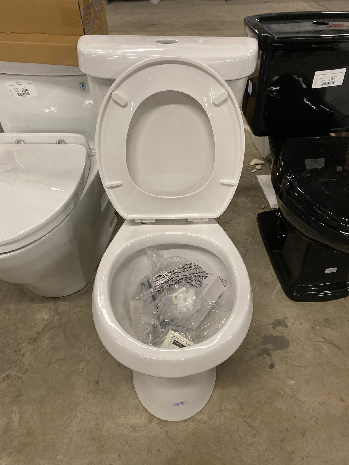 2-piece 1.1 GPF/1.6 GPF High Efficiency Dual Flush Complete Elongated Toilet in White, Seat Included