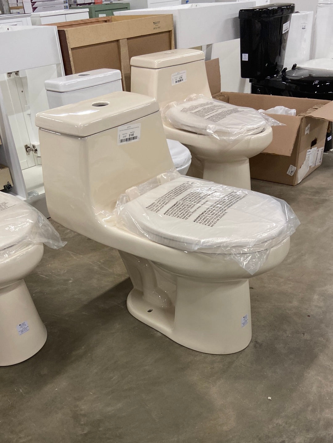 1-Piece 1.1 GPF/1.6 GPF High Efficiency Dual Flush Elongated All-in-One Toilet in Bone