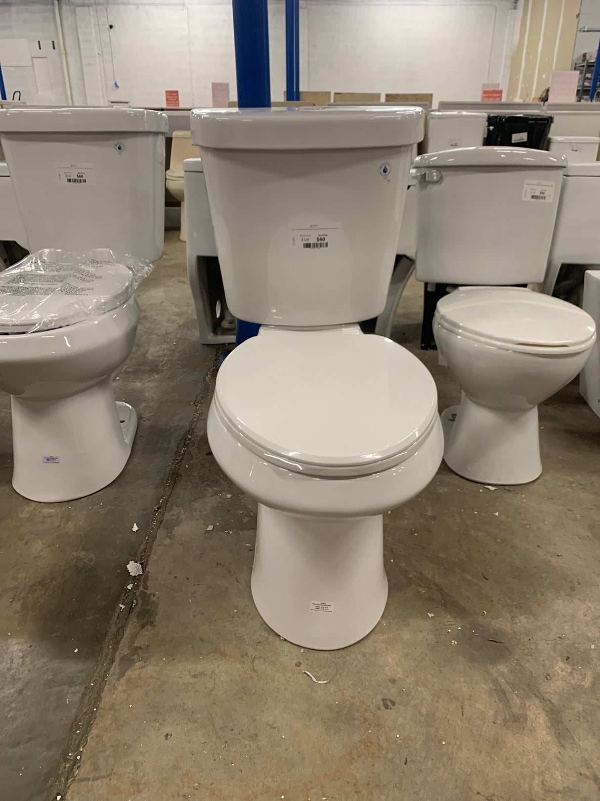 2-piece 1.1 GPF/1.6 GPF High Efficiency Dual Flush Complete Elongated Toilet in White, Seat Included