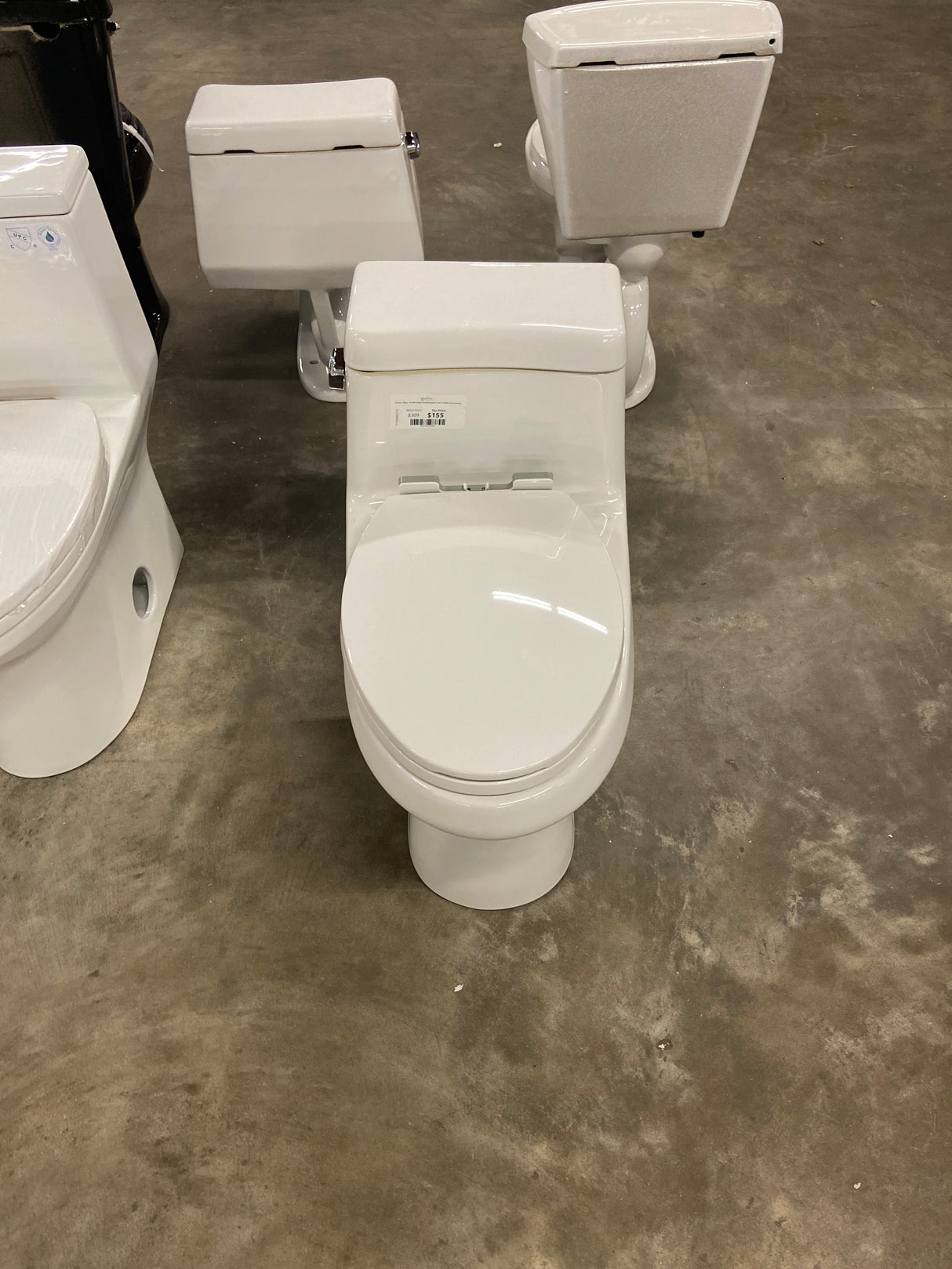 Colony 1-Piece 1.28 GPF Single Flush Elongated Toilet in White Seat Included