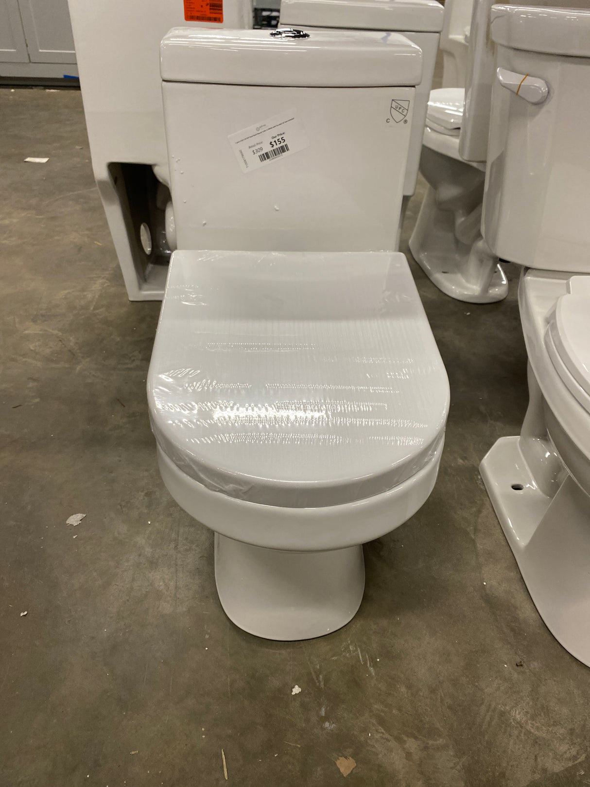 1-piece 0.8/1.28 GPF Dual Flush Round Toilet in White with Durable UF Seat Included