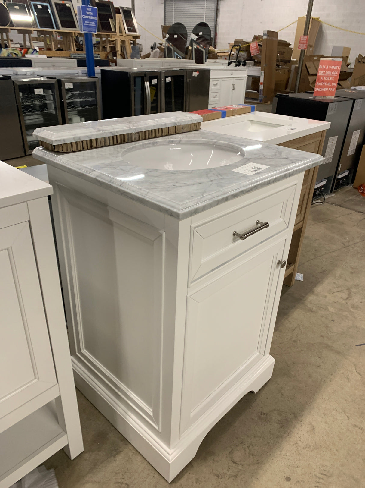 Windlowe 24 in. W x 22 in. D x 35 in. H Bath Vanity in White with Carrera Marble Vanity Top in White with White Sink