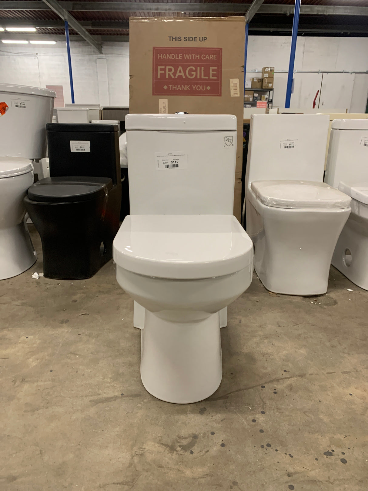 One-Piece 1.1/1.6 GPF Dual Flush Round Toilet in White Soft Close Seat Included