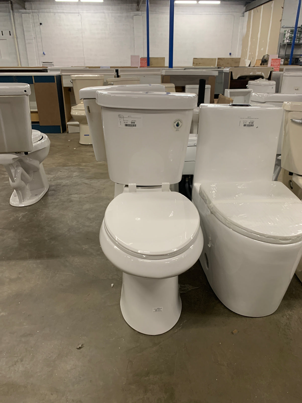 2-piece 1.1 GPF/1.6 GPF High Efficiency Dual Flush Complete Elongated Toilet in White, Seat Included