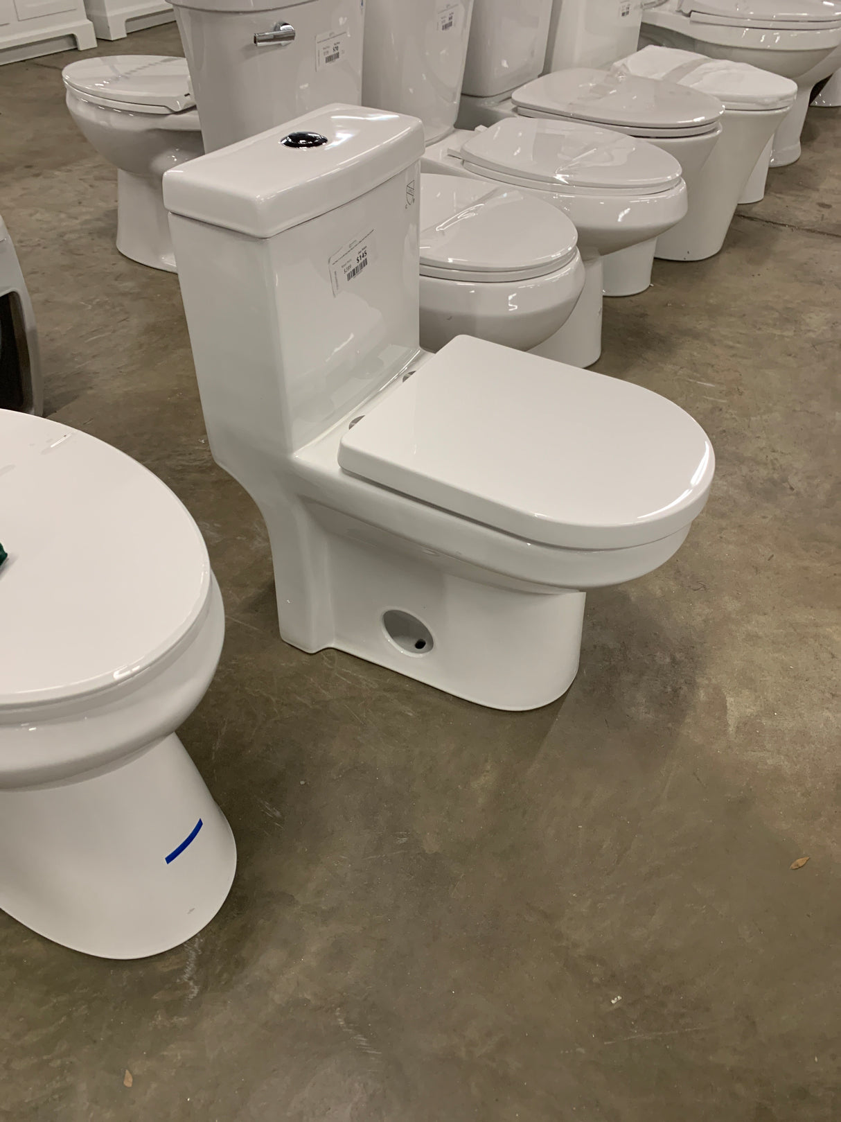 One-Piece 1.1/1.6 GPF Dual Flush Round Toilet in White Soft Close Seat Included