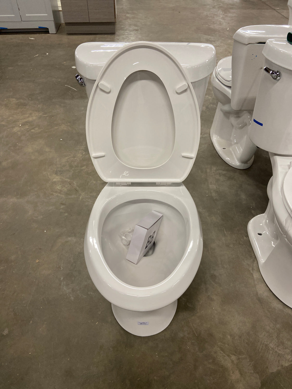 10 in. Rough in. 2-Piece 1.28 GPF Single Flush Elongated Toilet in White, Seat Included