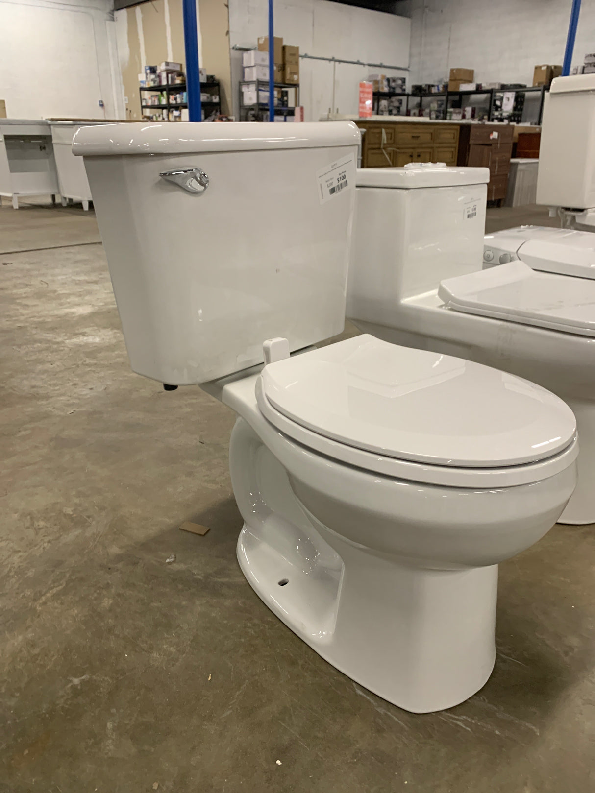 Reliant 10 in. Rough-In 2-Piece 1.28 GPF Single Flush Round Toilet in White, Seat Included