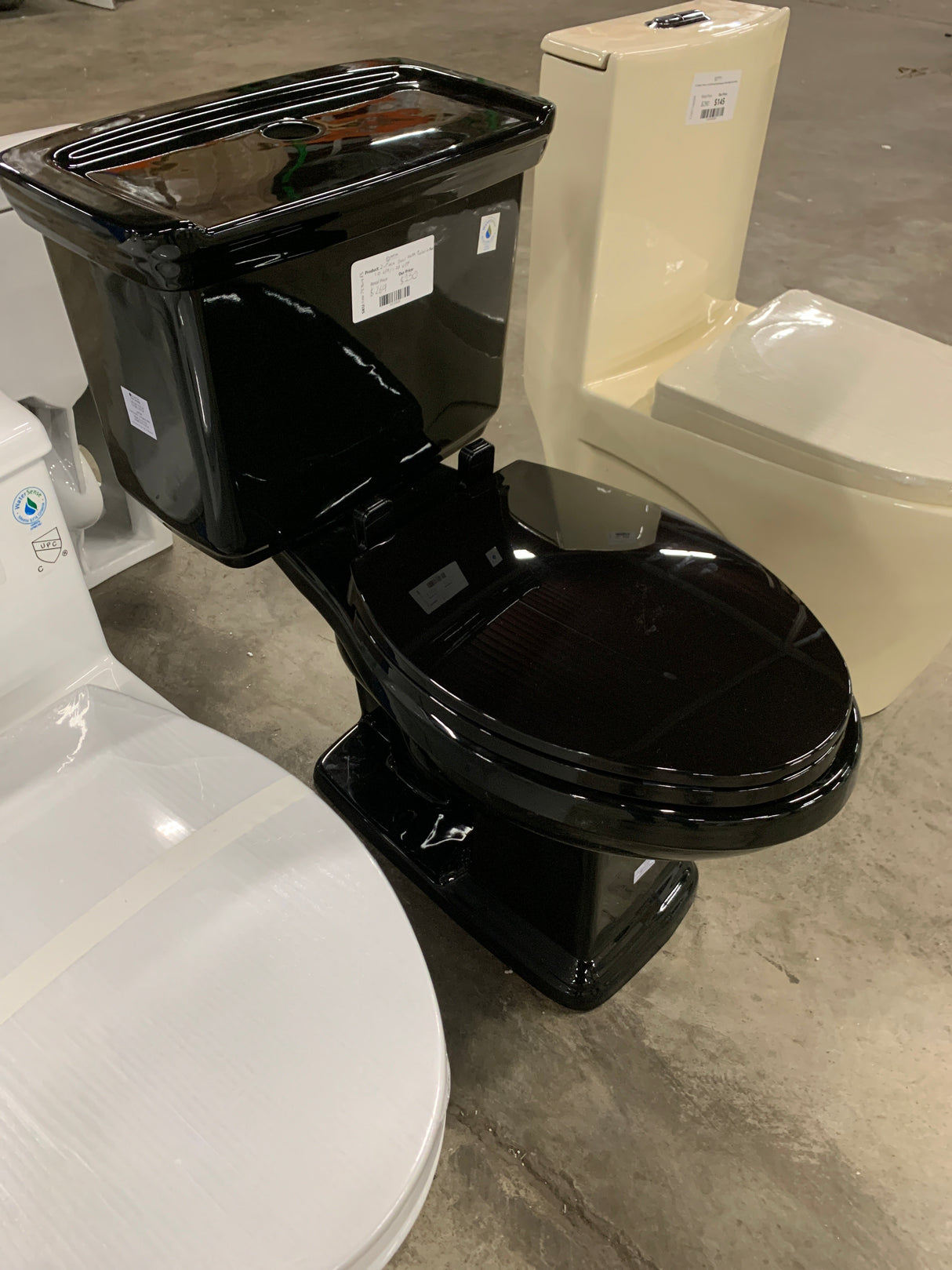 2-piece 1.0 GPF/1.28 GPF High Efficiency Dual Flush Elongated Toilet in Black, Seat Included