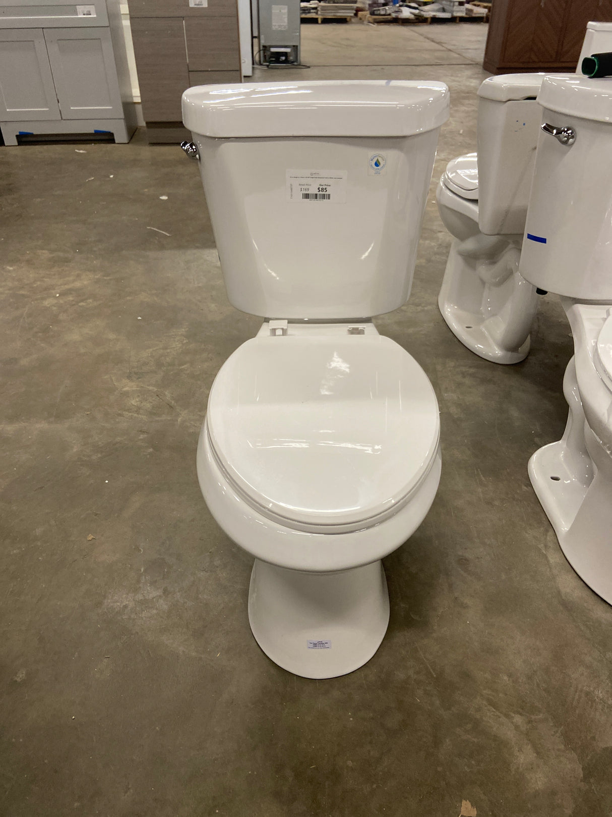 10 in. Rough in. 2-Piece 1.28 GPF Single Flush Elongated Toilet in White, Seat Included