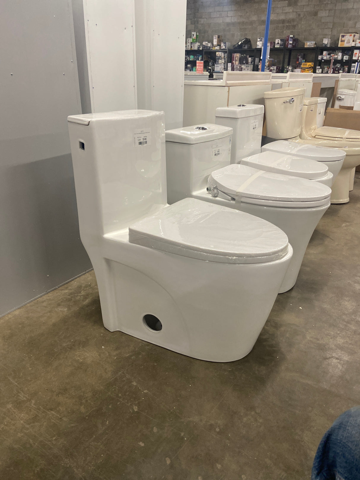 St. Tropez 1-Piece 1.28 GPF Single Flush Elongated Toilet in White Seat Included