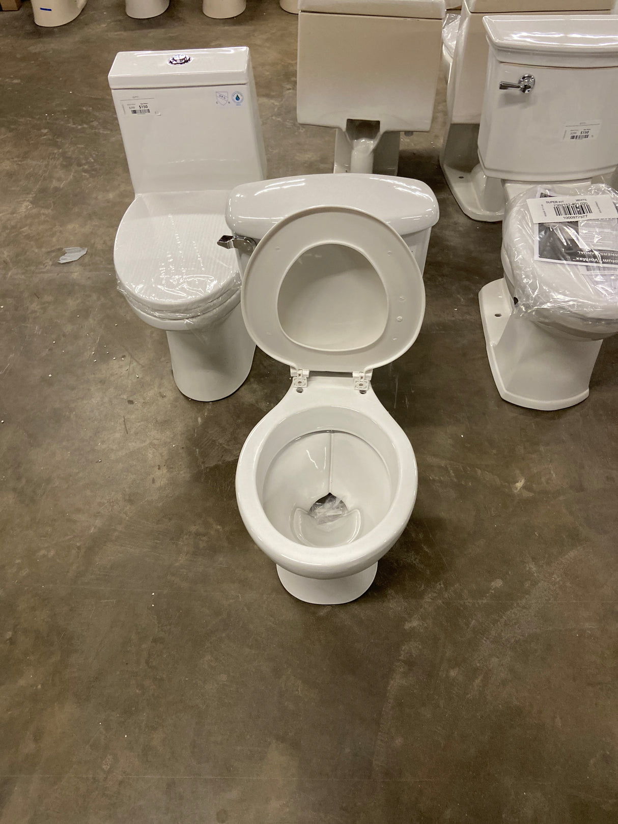 Foundations 2-Piece 1.28 GPF Single Flush Round Toilet in White