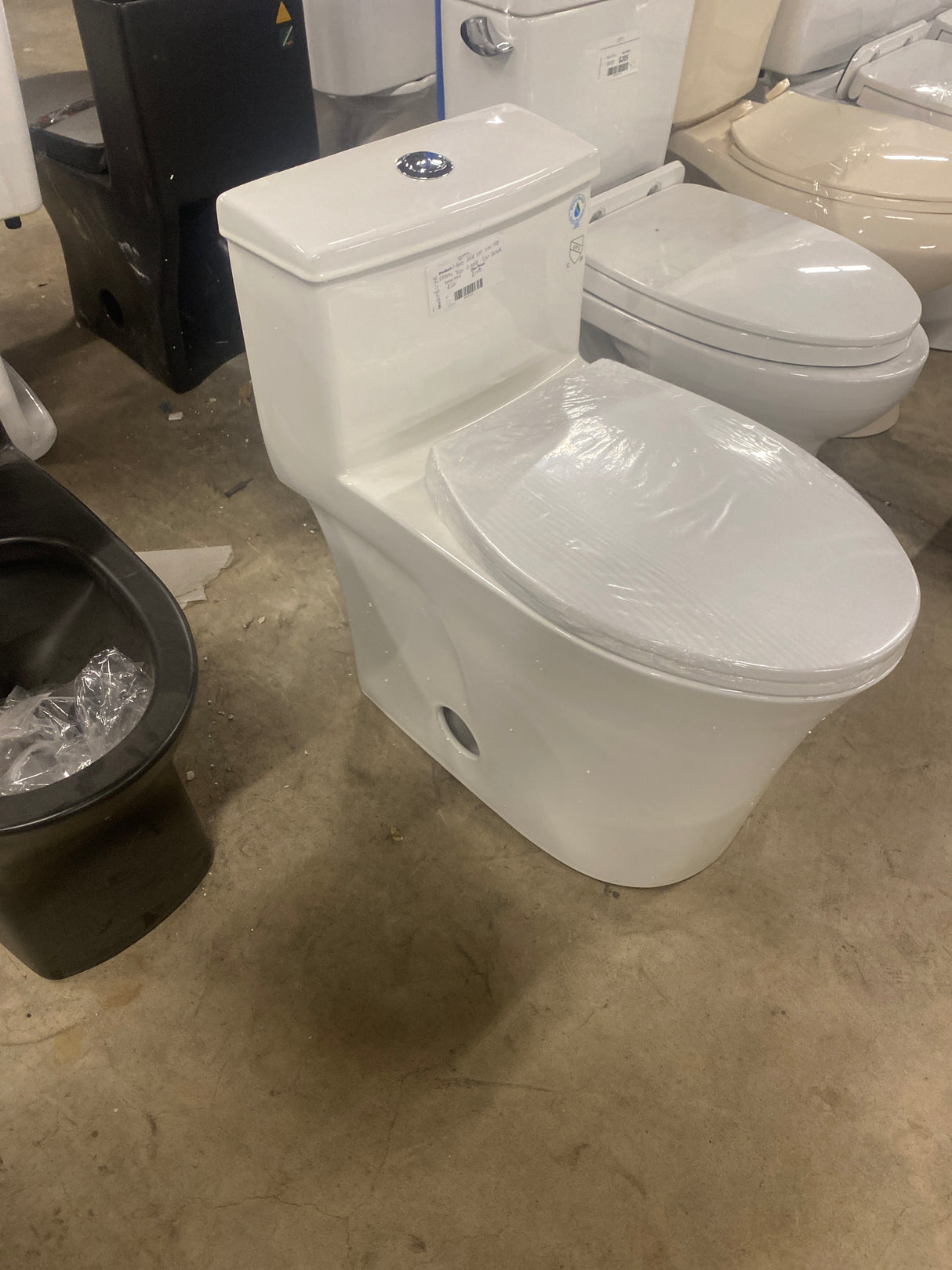 1-piece 0.8/1.28 GPF Dual Flush Elongated Toilet in White Seat Included