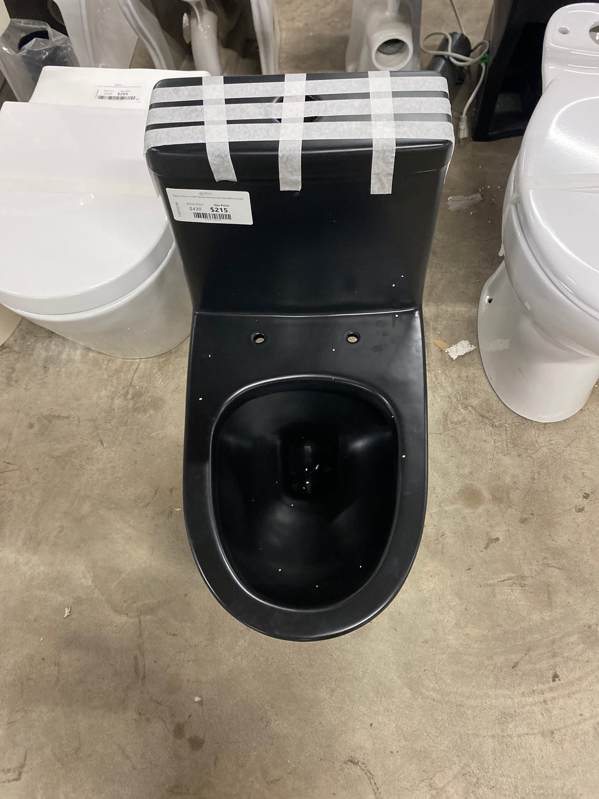 Sublime II 1-Piece 1.1/1.6 GPF Toilet Dual Flush Round Toilet in Matte Black Seat Included