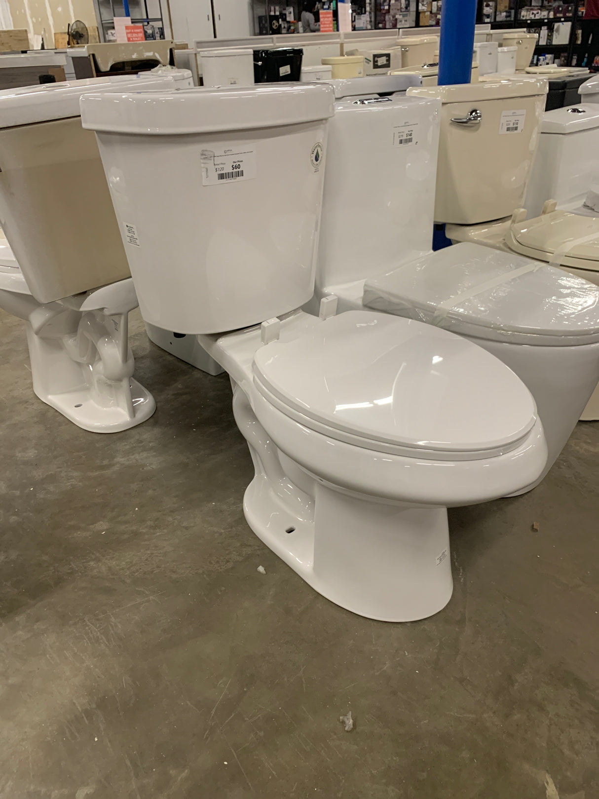 2-piece 1.1 GPF/1.6 GPF High Efficiency Dual Flush Complete Elongated Toilet in White, Seat Included