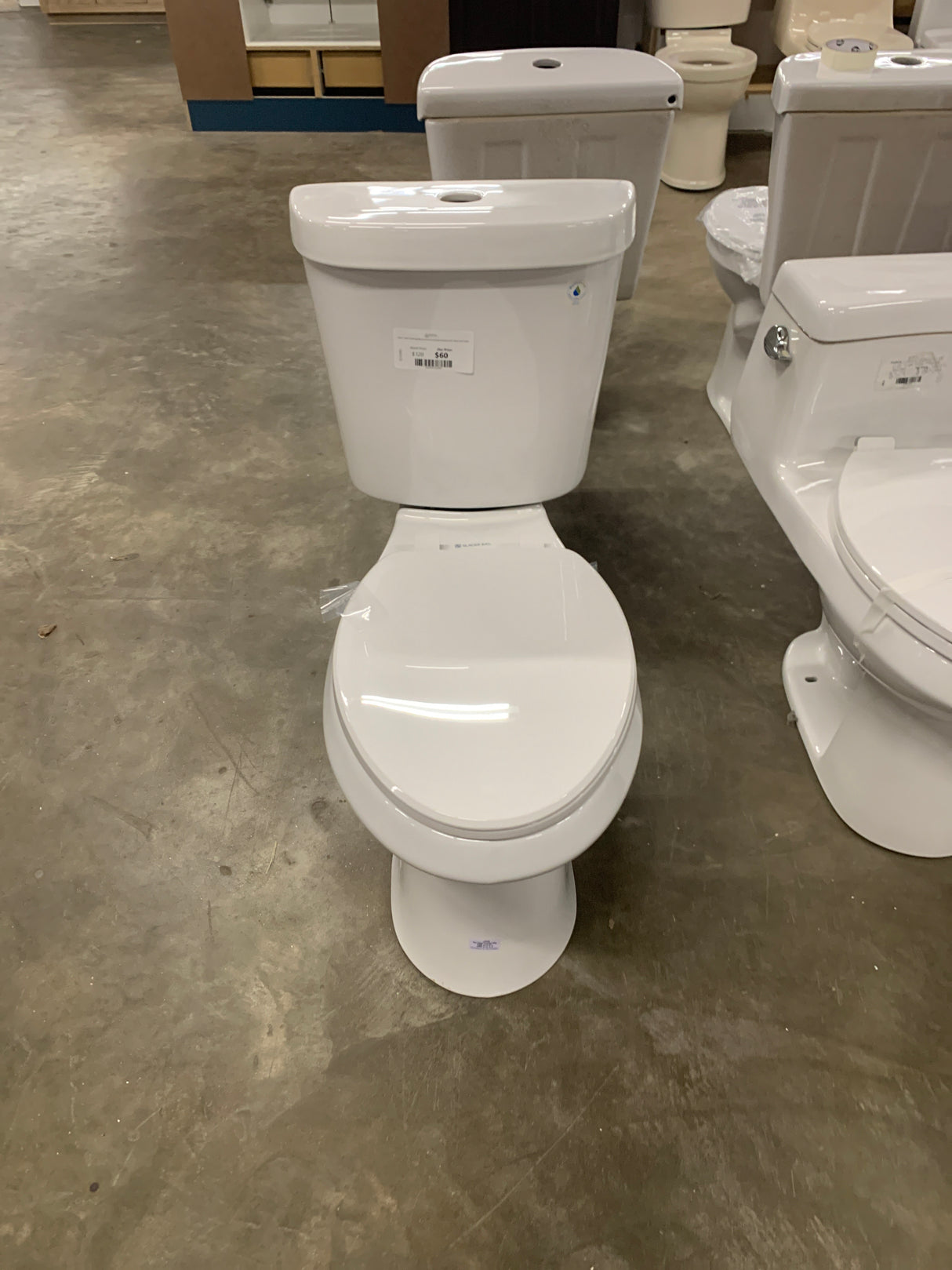 2-piece 1.1 GPF/1.6 GPF High Efficiency Dual Flush Complete Elongated Toilet in White, Seat Included