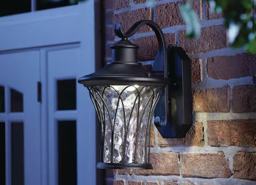 Avia Falls 14.5 in. Black Dusk to Dawn Large LED Outdoor Wall Light Fixture with Clear Water Glass