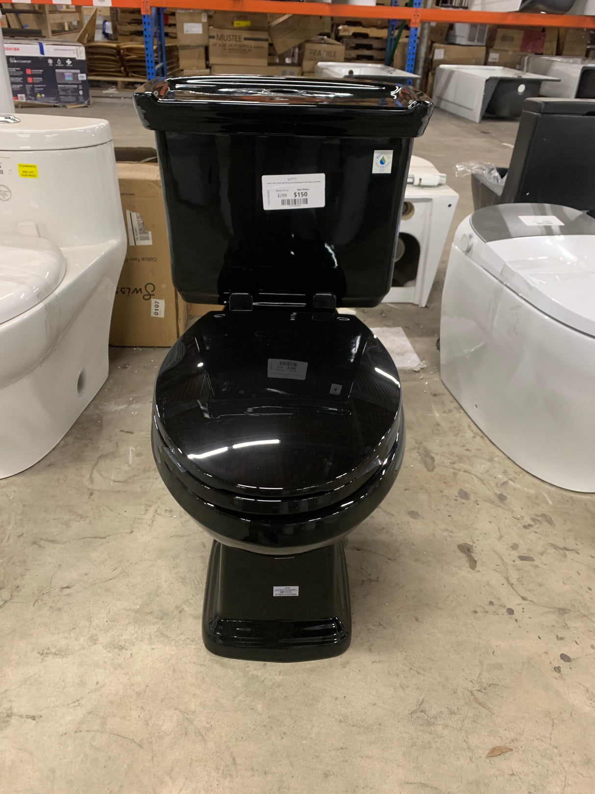 2-piece 1.0 GPF/1.28 GPF High Efficiency Dual Flush Elongated Toilet in Black, Seat Included